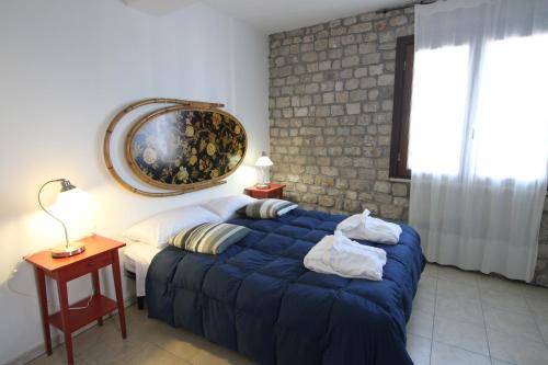מיטה או מיטות בחדר ב-Le Camere Pinte