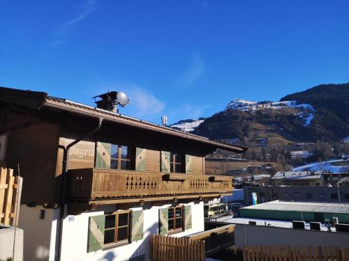 a balcony on top of a building with a mountain at Haus Ingrid in Kitzbühel