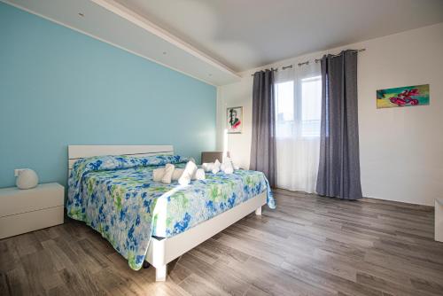 Кровать или кровати в номере L' Arcobaleno B&B