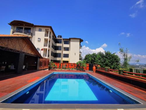a swimming pool on the roof of a building at Peponi Living Spaces in Kigali