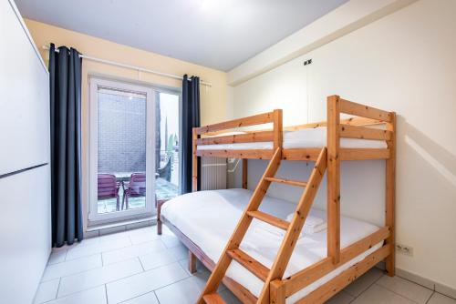 Ένα ή περισσότερα κρεβάτια σε δωμάτιο στο Centrally located apartment in Knokke