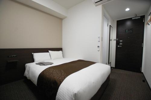 Postel nebo postele na pokoji v ubytování AI HOTEL Hashimoto