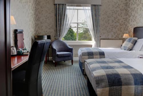 Un ou plusieurs lits dans un hébergement de l'établissement Best Western Forest and Vale Hotel