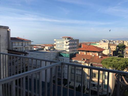 a view of a city from a balcony at Hotel Lukas Vegetarian & Vegan in Viareggio