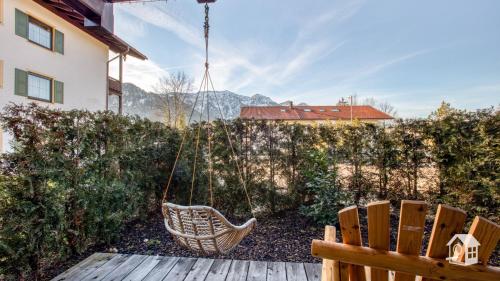 a swing in the backyard of a house at Chalet Harmonie in Inzell