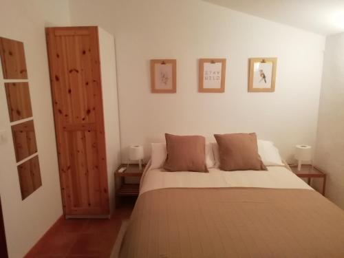 Säng eller sängar i ett rum på LA CASONA DE VALENZUELA