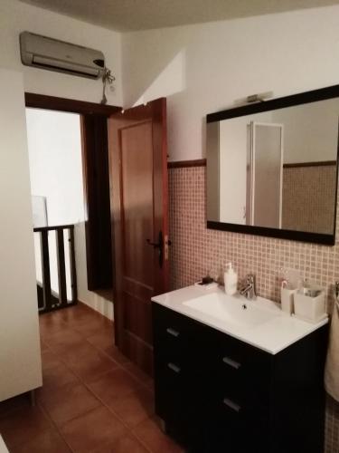 a bathroom with a sink and a mirror at LA CASONA DE VALENZUELA in Valenzuela