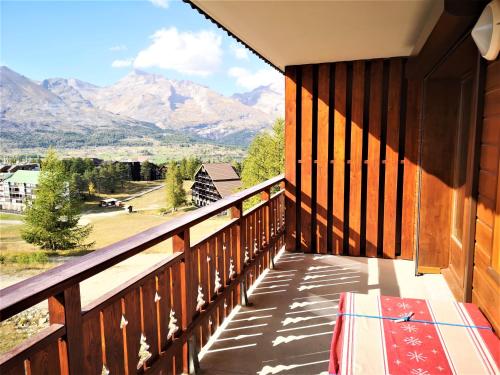 a balcony of a house with a view of mountains at Eden des Cimes, La Joue du Loup in La Joue du Loup