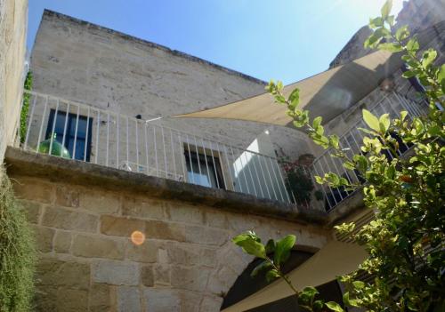a balcony on the side of a building at La Dimora delle Grazie in San Cesario di Lecce
