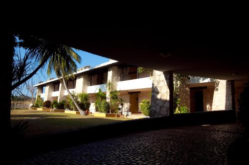 a person standing in front of a building at Hotel Tucan Siho Playa in Sihoplaya