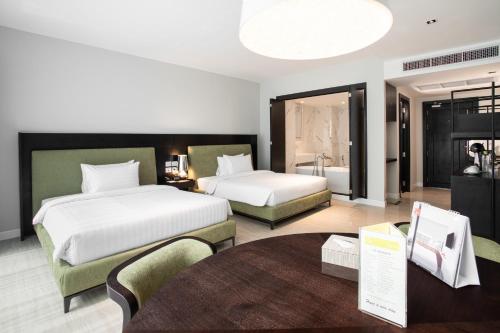 Postel nebo postele na pokoji v ubytování S Ram Leisure Hotel SHA PLUS
