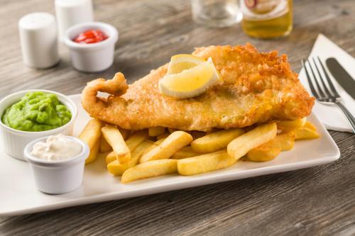 a plate of food with fish and french fries at Trethorne Hotel & Golf Club in Launceston