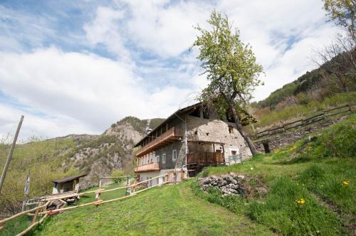 an old house on a hill in the mountains at La Cascina d'Orleans in Saint-Pierre