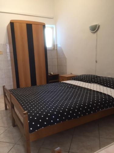 a bedroom with a bed in a room at Apartments "Villa Cupic"-Vodice in Vodice