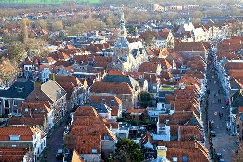an aerial view of a town with red roofs at De Verwennerie in Zierikzee