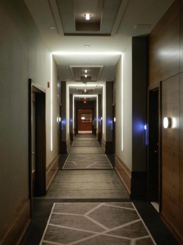 a hallway in a building with a long corridor at Radisson Hotel & Conference Centre Calgary Airport in Calgary