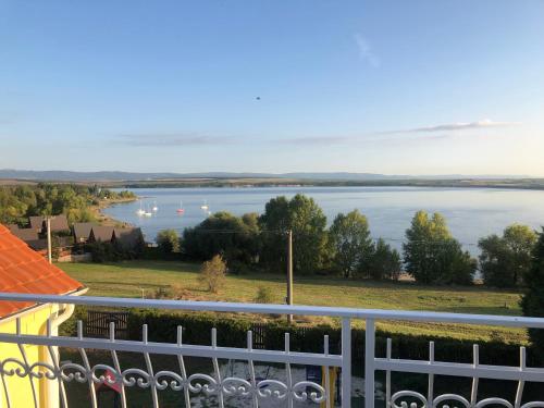 a view of a lake from a balcony at Holiday Centrum in Žatec