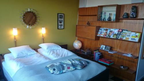a hotel room with two beds and a mirror at Hotell Hanöbris på Kivik in Kivik