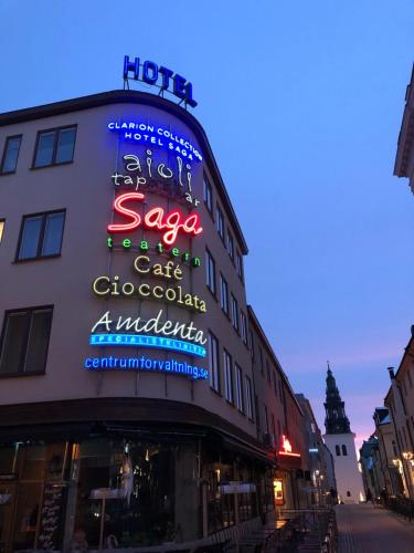 a building with neon signs on the side of it at Comfort Hotel Linköping City in Linköping