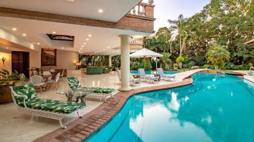 an image of a swimming pool in a house at Christies at 32 on Russell in Nelspruit