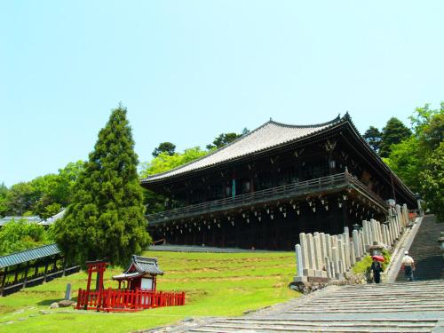 a large building with steps in front of it at Guesthouse Nara Komachi in Nara