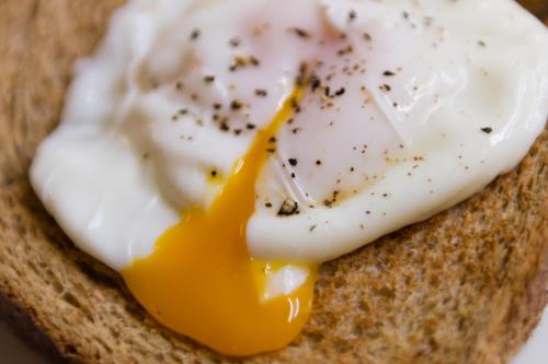 an egg on top of a piece of bread at Blue Swallow in Penrith