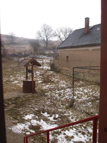 a basketball hoop in a field with snow on the ground at Hibiszkusz Haz in Bekölce