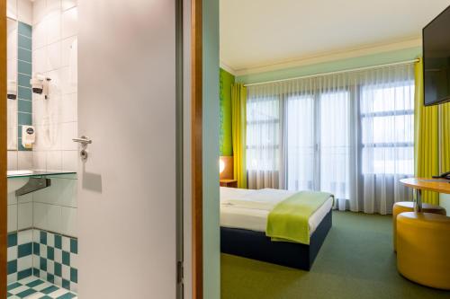 Ein Bett oder Betten in einem Zimmer der Unterkunft Hotel Fränkische Schweiz-Pegnitz