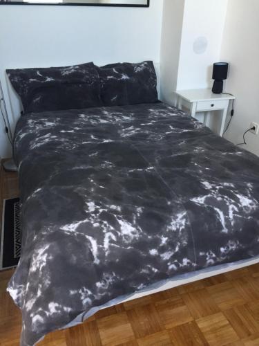 Posteľ alebo postele v izbe v ubytovaní Apartman Lara ***