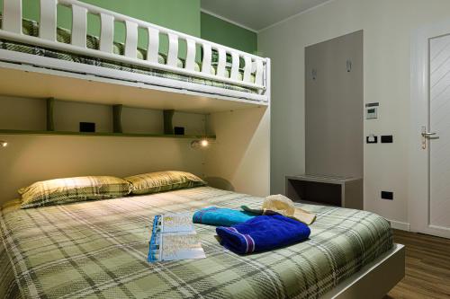 a bedroom with a bed with a bunk bed at Millefiori in Cagliari