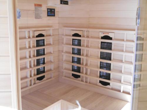 a wine cellar with wooden shelving in a room at Bergappartement Talblick in Sankt Veit in Defereggen