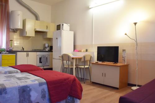 Kuchyň nebo kuchyňský kout v ubytování B&B via Roma
