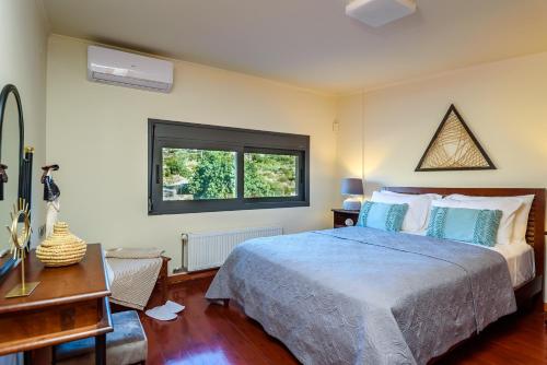 Ένα ή περισσότερα κρεβάτια σε δωμάτιο στο Marathi Oasis Beach Villa