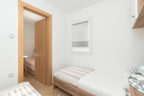 Posteľ alebo postele v izbe v ubytovaní Mobile home Sea Turtle
