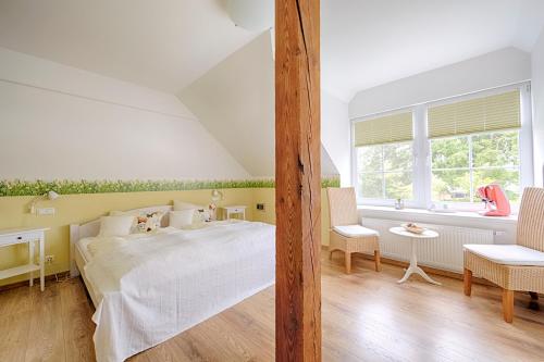Een bed of bedden in een kamer bij Elbhof Harnisch