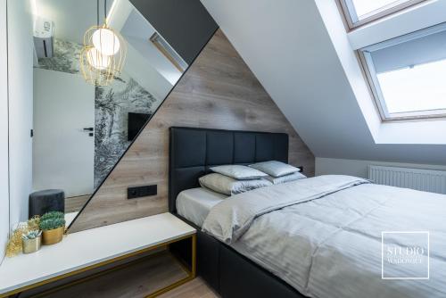 Posteľ alebo postele v izbe v ubytovaní Apartamenty Premium New