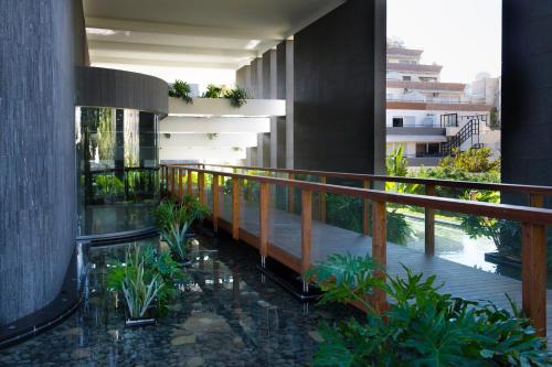 a balcony of a building with plants on it at Carmencita Studio B14 with pool & gym in Limassol