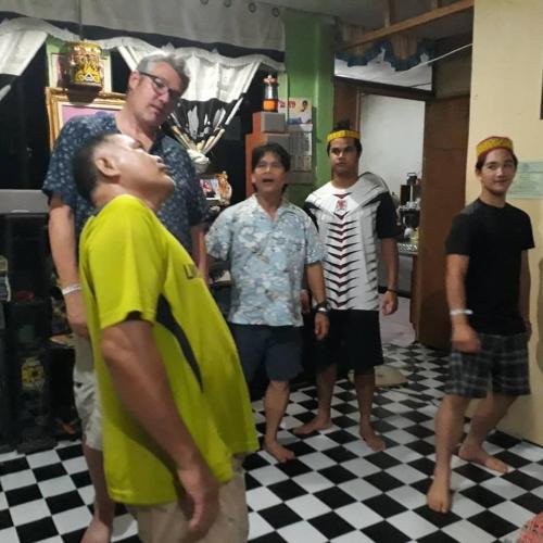 a group of men standing in a room at Mulu D Cave Homestay Room 2 in Mulu