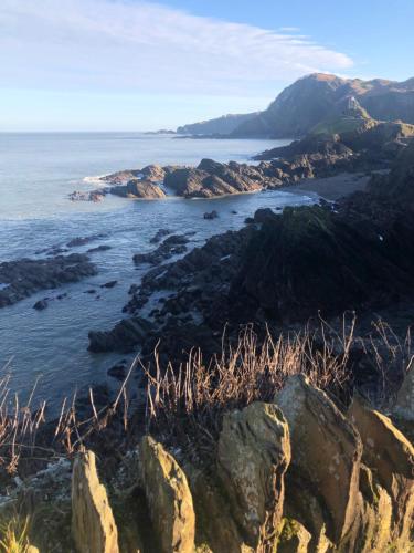 a view of the ocean from a rocky coast at The Devonian in Ilfracombe