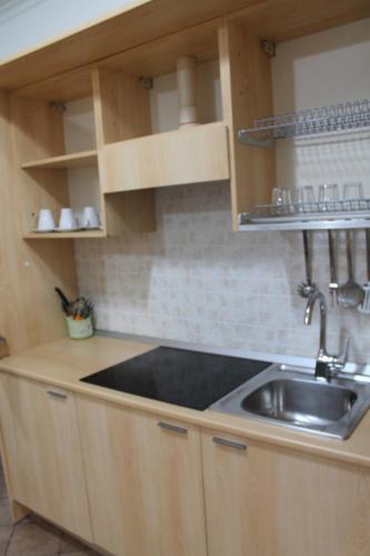 a kitchen with a sink and a counter top at Residence Sol Levante in Frascati
