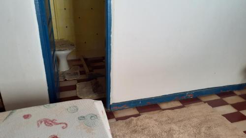 Ένα ή περισσότερα κρεβάτια σε δωμάτιο στο Casa de Praia Ilhéus