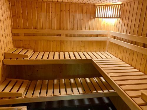 a wooden sauna with two bunk beds in it at Chalet Das Atrium in Radstadt