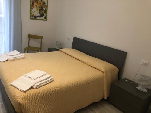 Łóżko lub łóżka w pokoju w obiekcie Casa Vincenzina