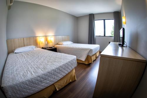 Postel nebo postele na pokoji v ubytování Hotel Campo Largo Express