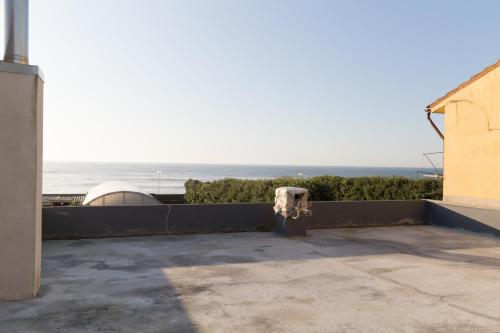 a view of the ocean from the balcony of a house at Mar Rosa in Aguçadoura
