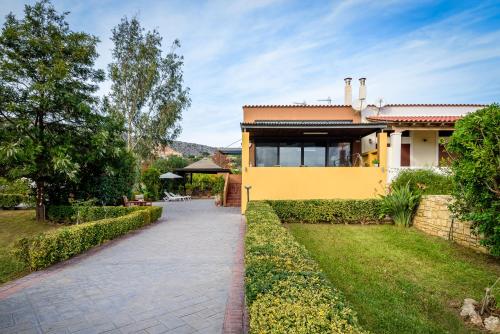 Κήπος έξω από το Marathi Oasis Beach Villa