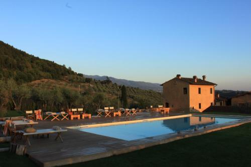 a villa with a swimming pool and a house at I Veroni - Agriturismo and Wine Cellar in Pontassieve