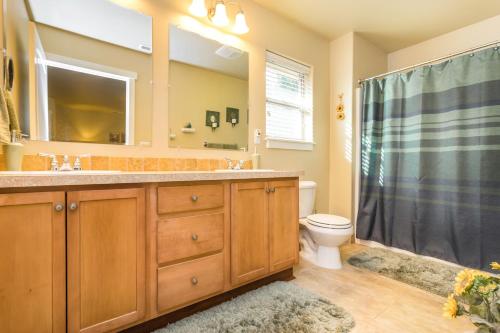 a bathroom with a sink and a toilet and a shower at Charming Wine Country Retreat! 4 Bedroom 2 Bath in Walla Walla