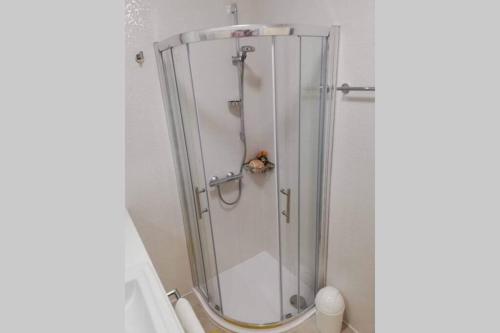 a shower with a glass door in a bathroom at Apartment Altitudo Split sea and city view terrace comfortable and new in Split