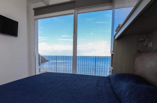 A bed or beds in a room at Barbara's house - Sardinia